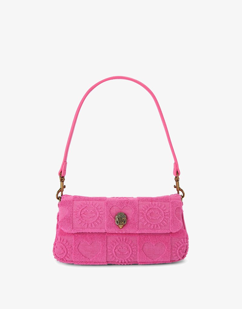 Pink shoulder bag with embossed heart and sun patterns, gold-toned clasp shaped like a shell, and detachable strap.