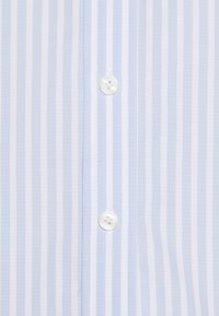 Light blue and white striped shirt, made of fabric with a smooth texture, featuring a row of white buttons along the front placket.