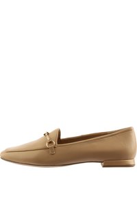 Beige leather loafers with a pointed toe, featuring a gold-tone ring accent and a low block heel. Smooth texture with minimal stitching.