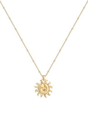 Gold metal necklace with a round sun pendant featuring a face and radiating rays. Chain includes small spherical links.