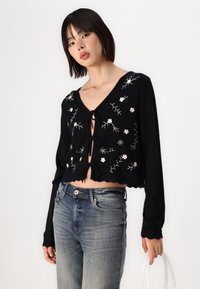 Object OBJTHESS  - Vesta na kopčanje - black