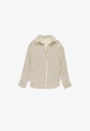 Blouse beige à manches longues avec des rayures verticales noires, boutonnage sur le devant et col classique.
