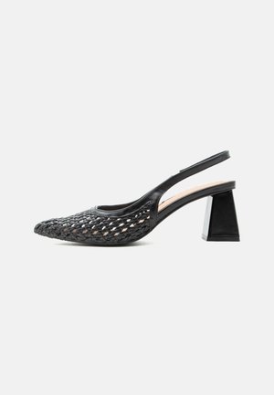 Black slingback shoe with woven pointed toe and chunky mid-height block heel on a white background.