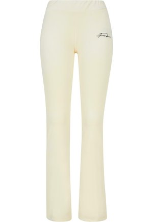 Cream-colored flared pants with an elastic waistband, featuring a small black "Febu" logo on the left thigh. Smooth, stretchy fabric.