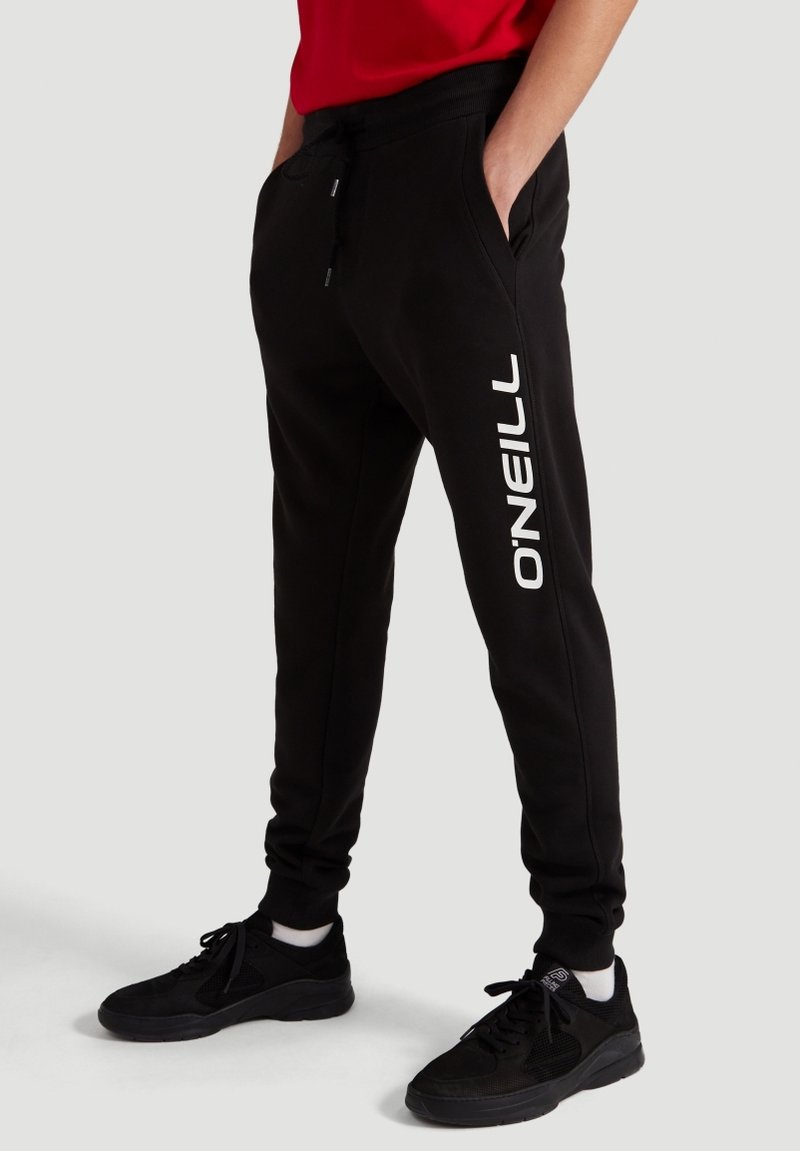 Sorte sweatpants med en tapered design, med et hvidt "O'Neill" logo langs venstre ben, lavet af et blødt, tekstureret stof.