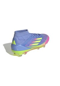 Purple soccer cleat with a high ankle design, featuring yellow and pink accents, textured upper, and clear studs for traction.