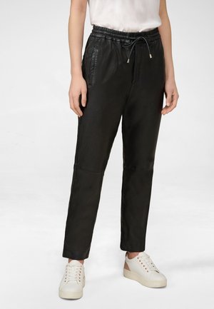 EMILIA - Leather trousers - schwarz