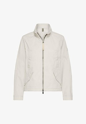 Lysebeige jakke med lynlås, ståkrave, to skrå forlommer, lange ærmer og lige kant.