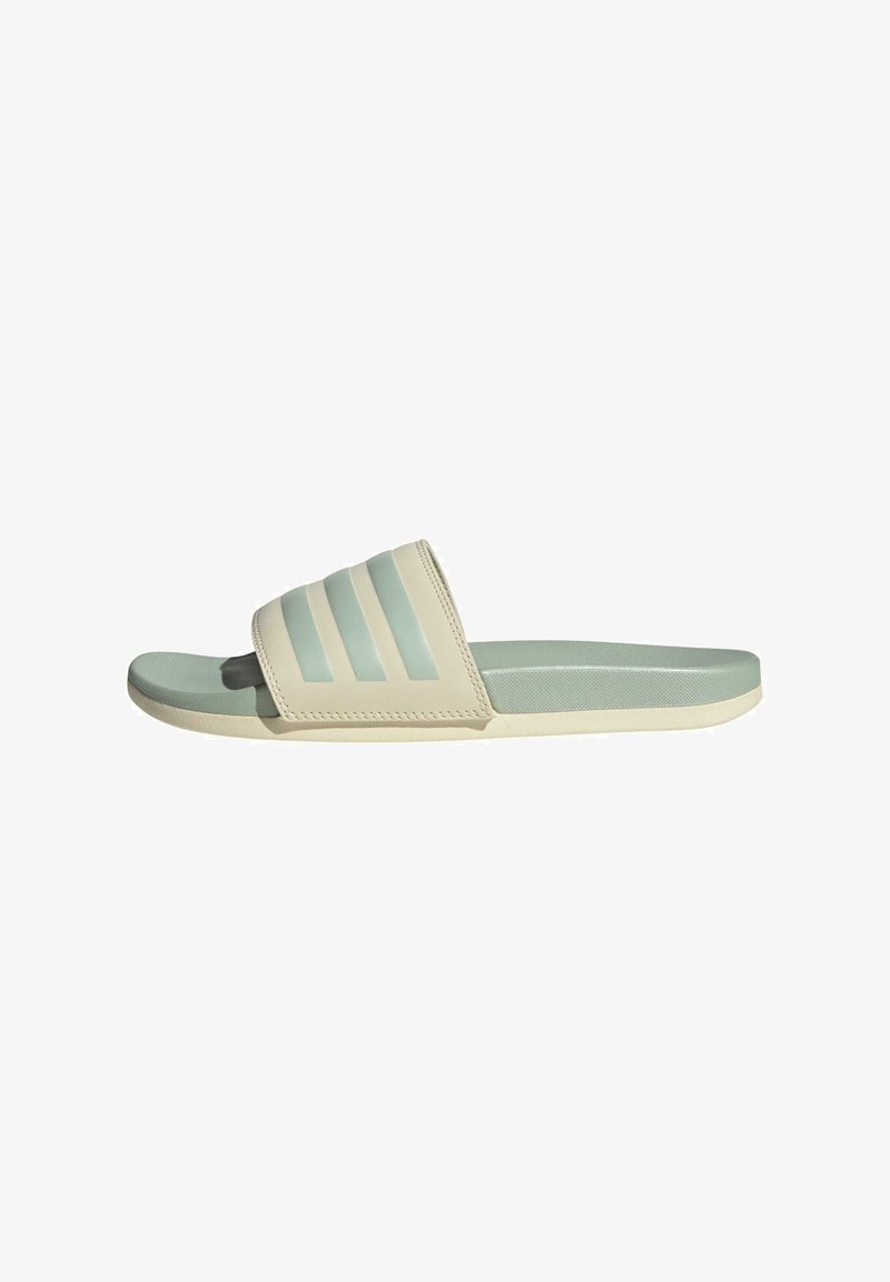 Light beige slide sandal with a wide strap featuring three horizontal mint green stripes. Smooth texture and flexible sole.