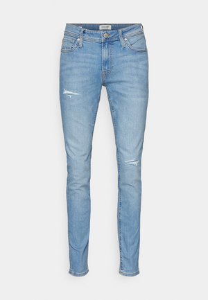 Ljusblå skinny jeans i denim, med slitna detaljer, en standard femficksdesign och knappstängning vid midjan.