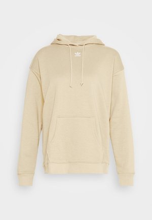 Beige Adidas hoodie met voorvak in kangaroestijl, verstelbare trekkoordkap en klein wit logo op de borst tegen een effen achtergrond.