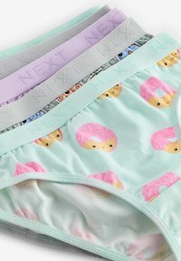 Paket med fyra par stretchunderkläder i bomull. Färger: mintgrön med donutmönster, lavendel, grå och ljusrosa resårmidjor.