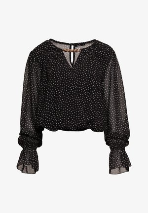Czarna bluzka z białym wzorem w trójkąty, z balonowymi rękawami i zebranym wykończeniem mankietów. Zapięcie na plecach w kształcie łezki z dekoracyjnym łańcuszkiem. Lekki, prześwitujący materiał.