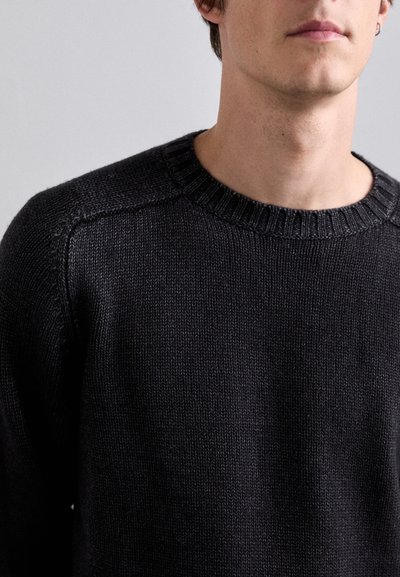 Black knitted sweater with a crew neck and ribbed collar, featuring a smooth texture and seamless shoulder design.