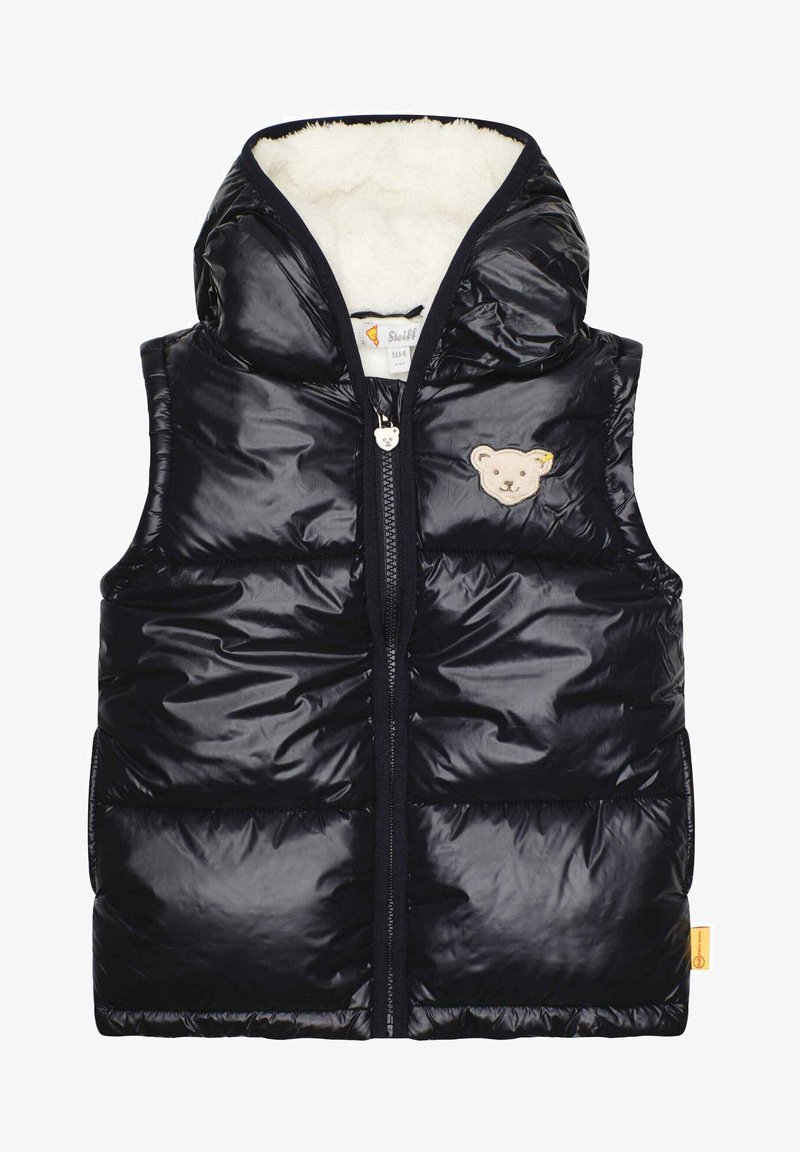 Schwarze Daunenweste mit Kapuze, ausgestattet mit einem weichen, cremefarbenen Innenfutter. Gestickter Teddy-Bären-Patch auf der linken Brust, mit Reißverschluss auf der Vorderseite.