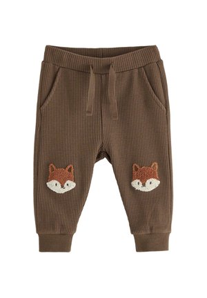 Bruine, gestructureerde sweatpants met een elastische band en twee zijzakken. Bevat geborduurde vosgezichten op elke dij.