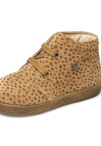 Stivale alla caviglia in suede marrone con motivo a pois, punta rotonda, design con lacci, fodera morbida e suola in gomma testurizzata. Presenta occhielli in metallo.