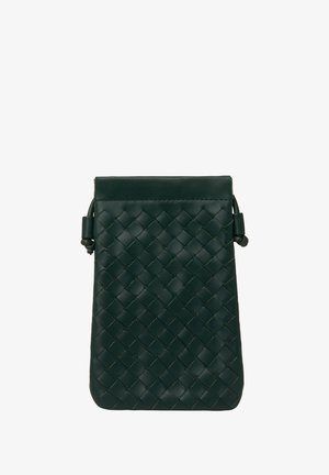 Woven leather bag in dark green with a structured shape. Features a top closure, adjustable strap, and distinctive texture from the weave.