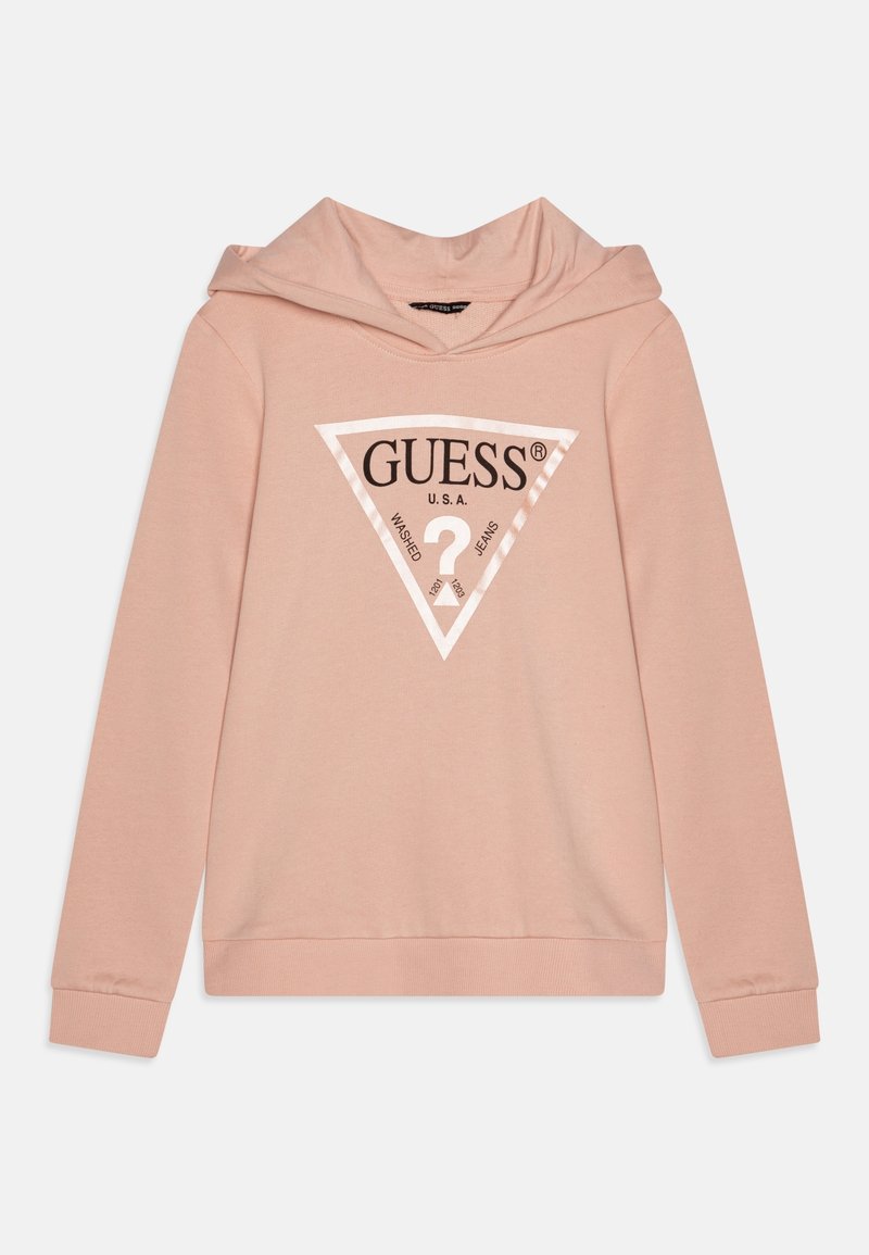 Felpa rosa chiaro con un logo triangolare bianco sul davanti che recita "GUESS U.S.A." e "Washed Jeans" attorno a un punto interrogativo.