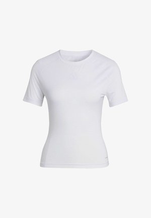 Camiseta deportiva blanca de manga corta, fabricada con material sintético texturizado, con un logo sutil en el pecho y diseño ajustado.