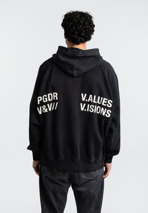 Black fleece hoodie with a large hood, featuring printed white text on the back: "PGDR V&V// V.ALUES V.ISIONS." Ribbed cuffs and hem.