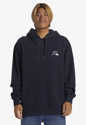 Navy hoodie made of soft cotton, featuring a front pocket, drawstring hood, and a white wave graphic on the chest. Casual fit with ribbed cuffs.