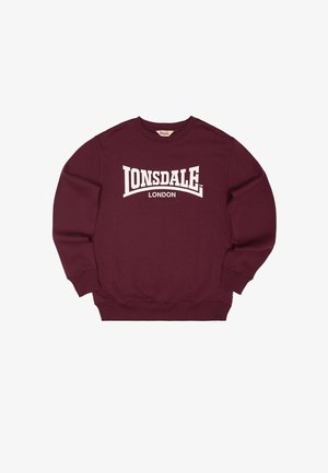 Tumši sarkans garroku džemperis ar uzrakstu "Lonsdale London" lieliem baltiem burtiem uz krūtīm, ar ribotām aprocēm un apakšmali.