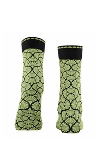 Grüne und schwarze Socken mit einem Blattmuster, einem schwarzen gerippten Bündchen und einer glatten Textur. Das Design hebt ein komplexes sich wiederholendes Motiv hervor.
