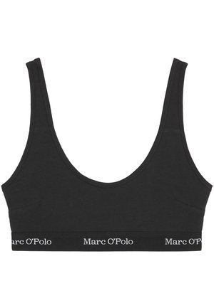 Black cotton bralette with wide shoulder straps, rounded neckline, and a logo band. Smooth texture and minimalistic design with no padding.