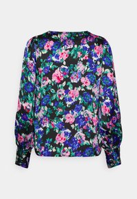 Blouse à manches longues avec poignets froncés, fond noir et motif floral dense en rose, violet, bleu et vert.