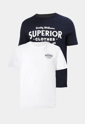 Two t-shirts: one navy blue with white graphic text "SUPERIOR CLOTHES," and one white with a smaller navy logo. Both are cotton, crew-neck.