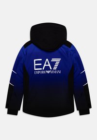 Blue and black hooded jacket featuring a gradient design, prominent EA7 logo in white, reflective accents, and adjustable cuffs.