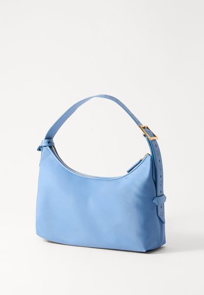 Soft blue leather handbag with a curved shape, zip closure, and a textured adjustable strap. Gold-tone hardware accents.