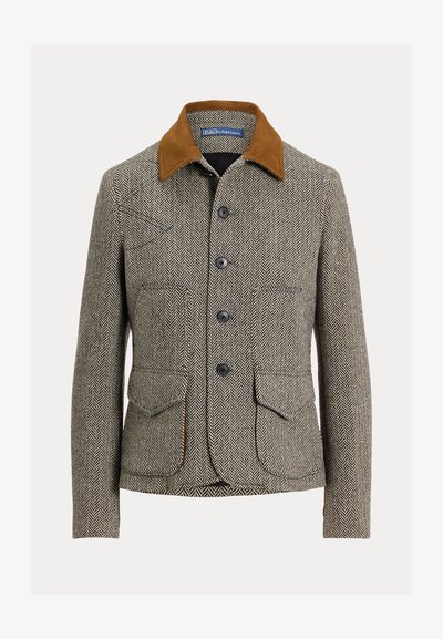 Brązowa marynarka w jodełkę z kołnierzem z aksamitu sztruksowego, zapinana na guziki, z dwoma przednimi kieszeniami i klasycznym fasonem.