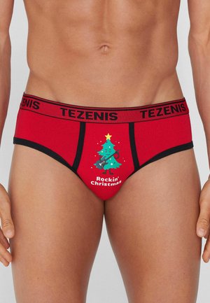 Rote Baumwollunterhose mit einem schwarzen Bund, auf dem das Logo "TEZENIS" steht, verziert mit einem Cartoon-Weihnachtsbaum und dem Text "Rockin' Christmas."