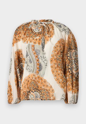 Blouse à manches longues avec encolure à cordon, présentant des motifs floraux et paisley orange, beige et gris sur un fond crème.