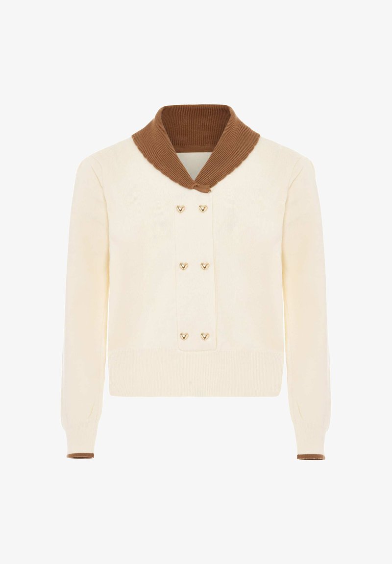 Pulover lung crem cu maneci lungi, guler șal dintr-un material ribbit maro și șase nasturi aurii în formă de inimă pe partea din față.