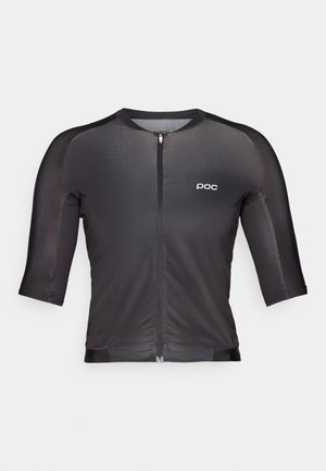 Schwarzes Radtrikot mit Dreiviertelärmeln, Frontreißverschluss und minimalem Branding. Hergestellt aus glattem, dehnbarem Material mit einer enganliegenden Passform.