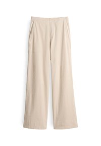 Beige weit geschnittene Hose aus einem weichen Stoff, mit gerippter Textur, elastischem Bund und zwei seitlichen Taschen.