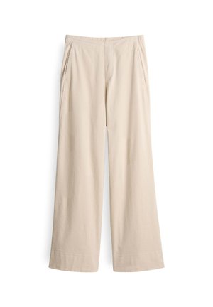 Pantaloni beige a gamba larga realizzati in un tessuto morbido, caratterizzati da una trama a coste, vita elasticizzata e due tasche laterali.