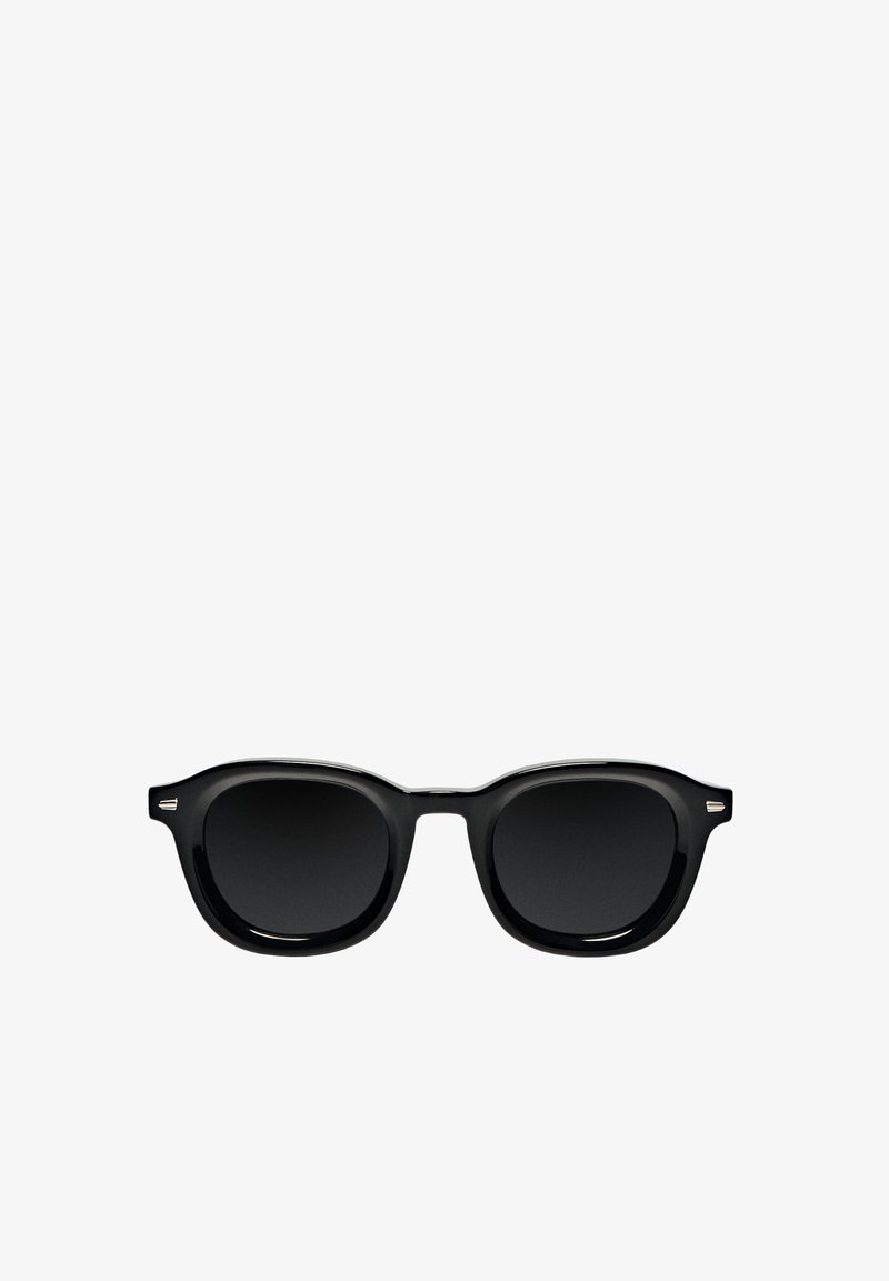 Black sunglasses with a classic rounded frame design, featuring dark lenses, smooth glossy finish, and metallic accents on the temples.