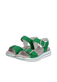 Grüne Sandalen mit verstellbaren Riemen, silbernen Schnallen, einer gepolsterten Fußbett und einer weißen Sohle mit grünem Streifen.