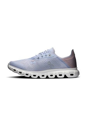 Light blue athletic shoe with mesh upper, round laces, and white sole featuring oval cutouts. Smooth texture on the heel for comfort.