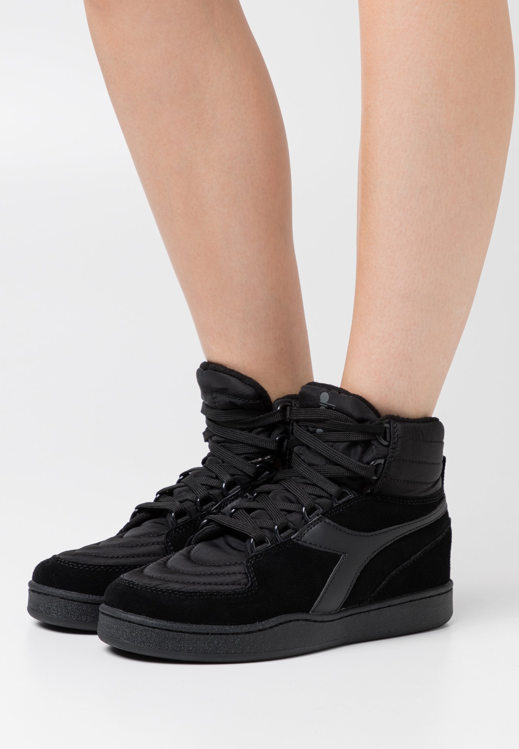 black diadora trainers