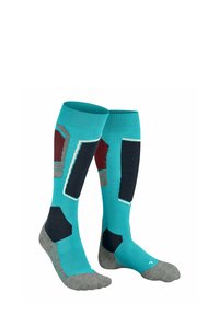 Skarpety do kolan wykonane z mieszanki materiałów. Turkusowe, granatowe, bordowe i szare z geometrycznymi wzorami oraz teksturowaną szaro-skalistą częścią stopy.