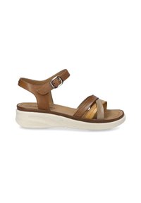 Brown leather sandals with adjustable ankle strap, featuring crisscrossed straps in tan and light brown, on a white, textured platform sole.