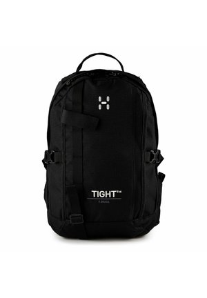 Zaino nero con maniglia superiore, fibbie laterali, cinghie anteriori e testo "TIGHT™ X SMALL" sul pannello frontale.