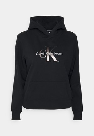 Black hooded sweatshirt with front pocket and metallic "CK Calvin Klein Jeans" logo centered on the chest.