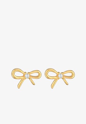 Gold bow-shaped earrings featuring a small clear gemstone at the center. Smooth texture with a polished finish.