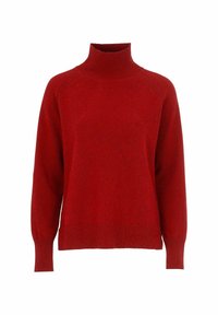 Röd polotröja med ribbat halsringning och manschetter, har en avslappnad passform, mjuk textur och raglanärmar för ökad rörelsefrihet.